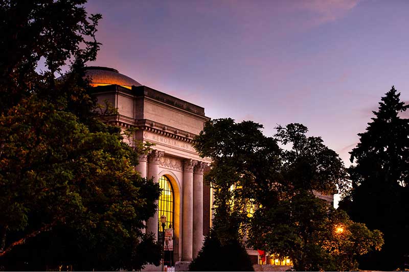 Memorial Union surrounded by trees at sunset