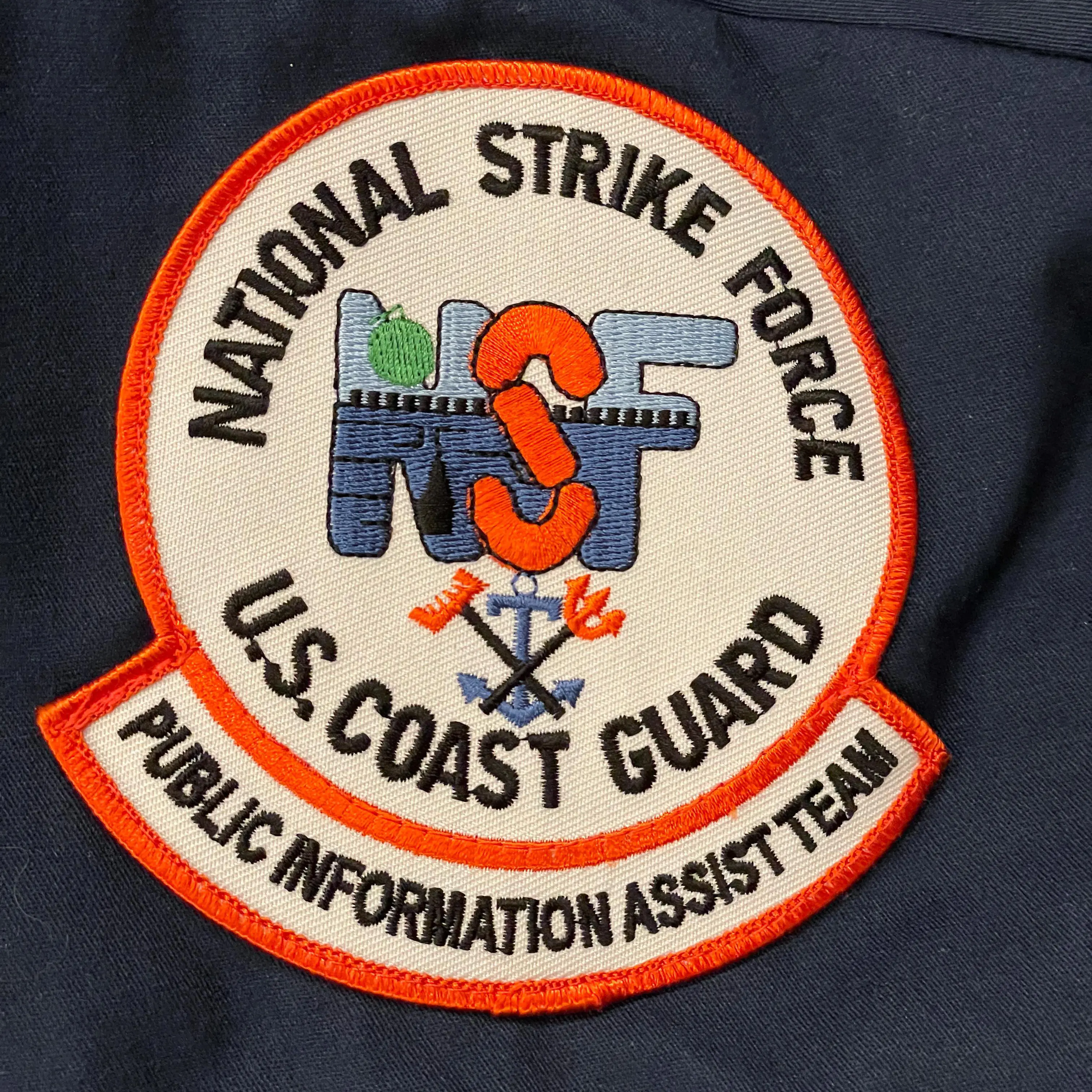 badge for uniform that says "National Strike Force U.S. Coast Guard. Public Information Assist Team"